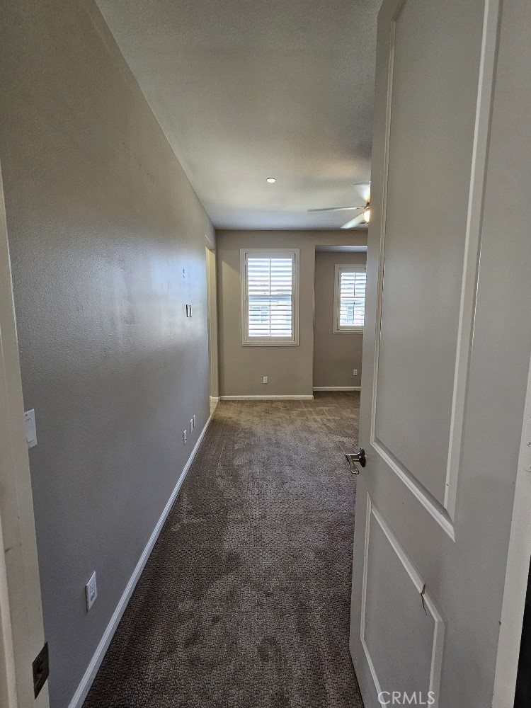 44011 Rivo Court Temecula, CA 92592 - Photo 18 of 34 a view of hallway with window and stairs
