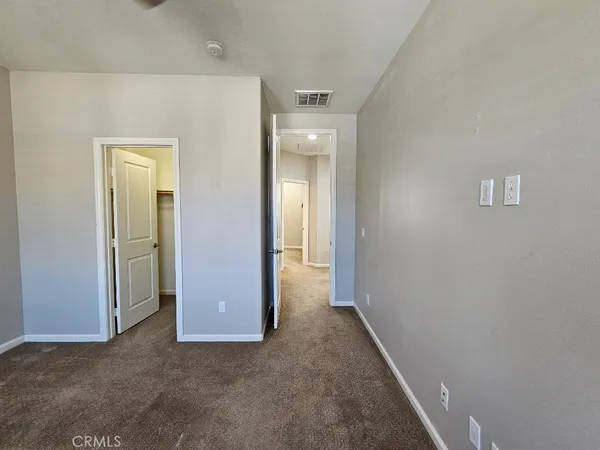 an empty room with a bathroom