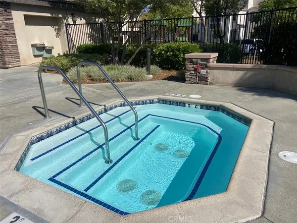 a view of a backyard with sitting area