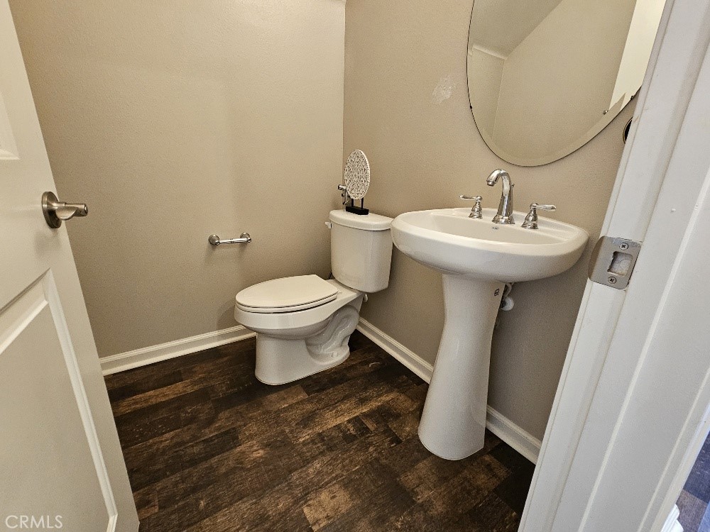 44011 Rivo Court Temecula, CA 92592 - Photo 6 of 34 a bathroom with a sink toilet and mirror