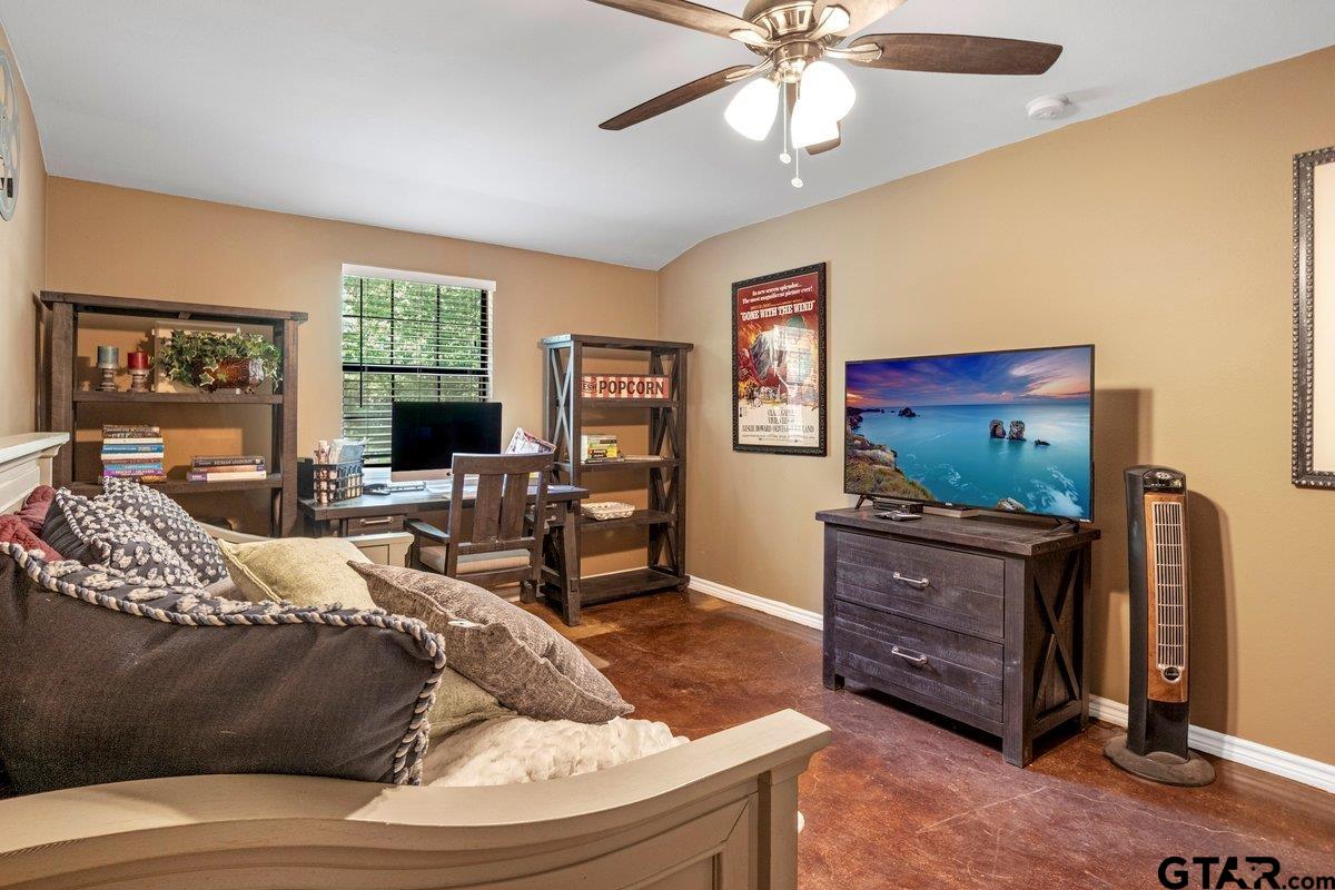 1254 Corinth Road Jacksonville, TX 75766 - Photo 14 of 42 a living room with furniture and a flat screen tv
