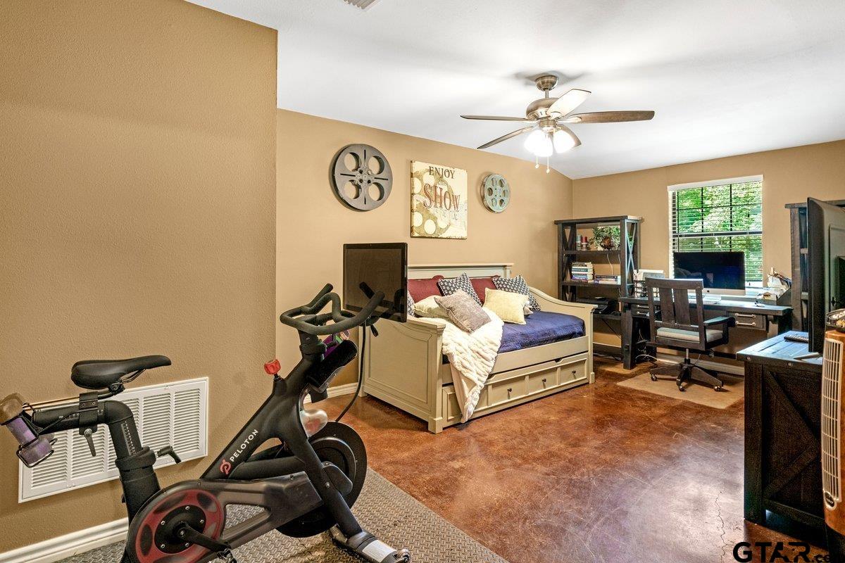 1254 Corinth Road Jacksonville, TX 75766 - Photo 15 of 42 a living room with furniture a flat screen tv and a window