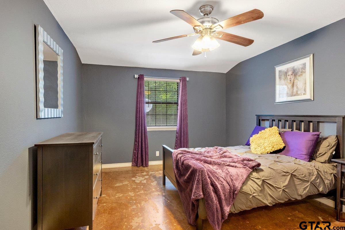 1254 Corinth Road Jacksonville, TX 75766 - Photo 21 of 42 a bedroom with a bed and a window