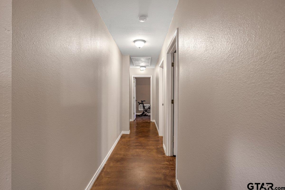 1254 Corinth Road Jacksonville, TX 75766 - Photo 22 of 42 a view of a hallway with wooden floor