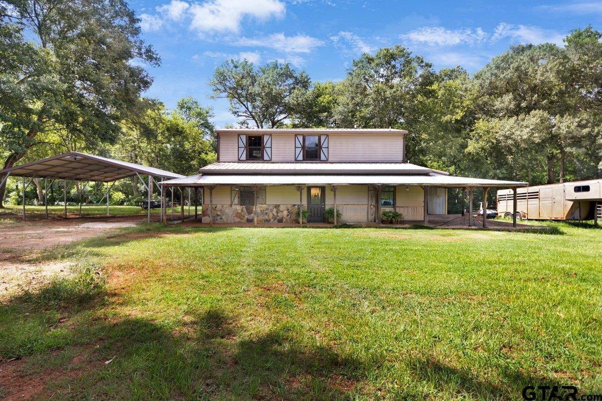 1254 Corinth Road Jacksonville, TX 75766 - Photo 3 of 42 a front view of a house with a yard