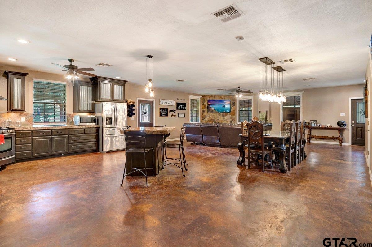 1254 Corinth Road Jacksonville, TX 75766 - Photo 33 of 42 a living room with lots of furniture and kitchen view