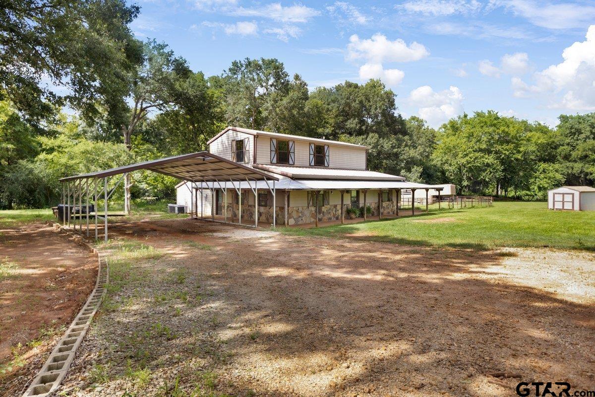 1254 Corinth Road Jacksonville, TX 75766 - Photo 4 of 42 a front view of a house with garden