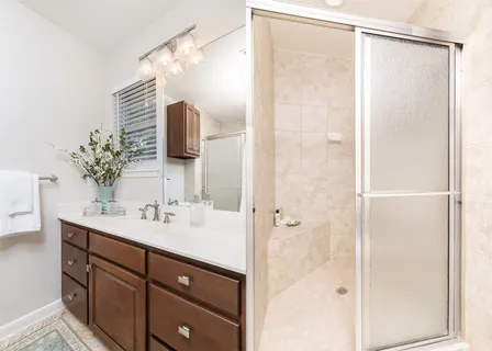 a spacious bedroom with a bed and a window