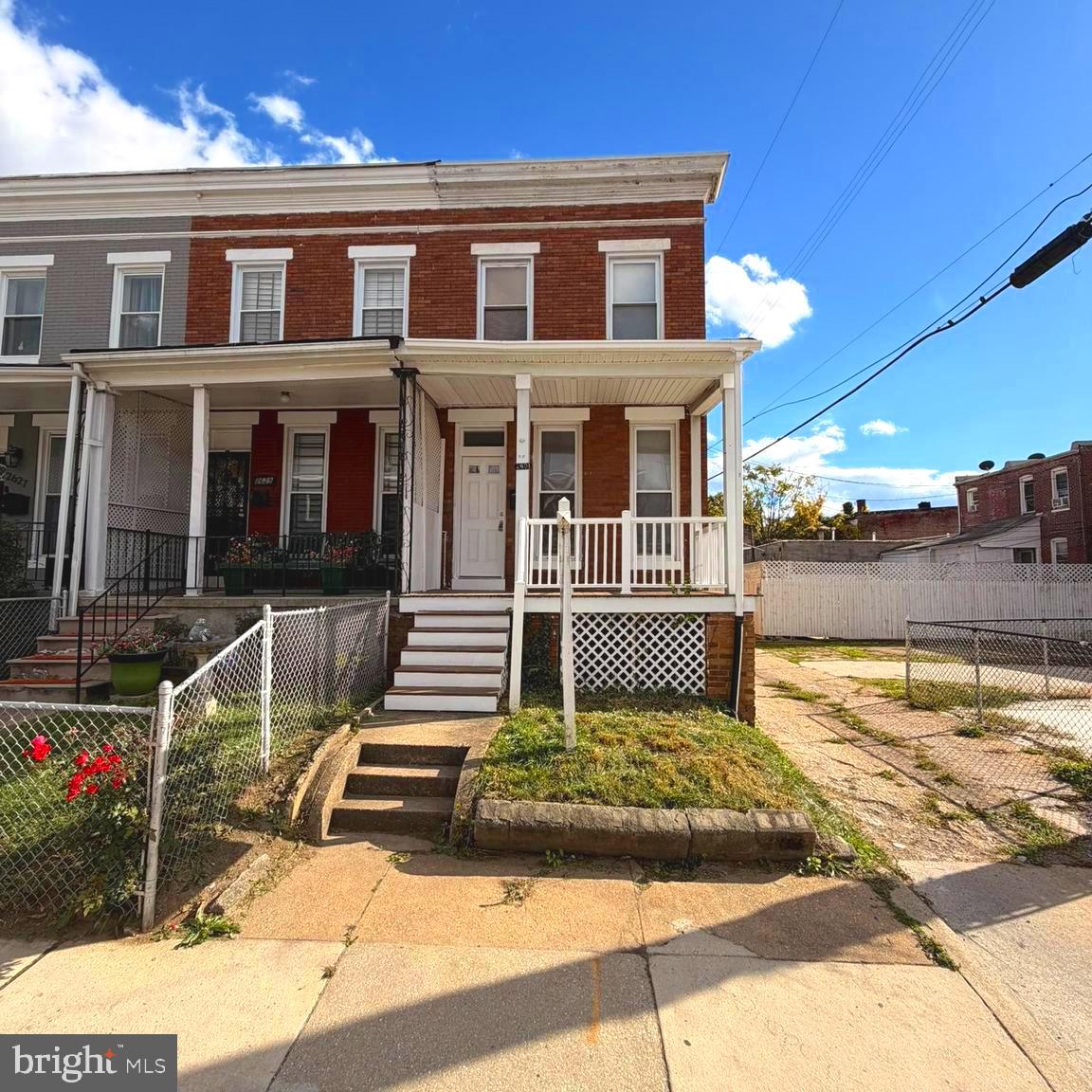 2631 West Cold Spring Lane Baltimore, MD 21215 - Photo 1 of 20 a view of a house with many windows