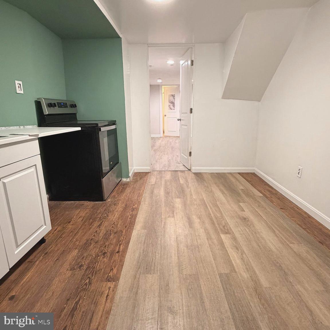 2631 West Cold Spring Lane Baltimore, MD 21215 - Photo 15 of 20 a view of a kitchen with wooden floor