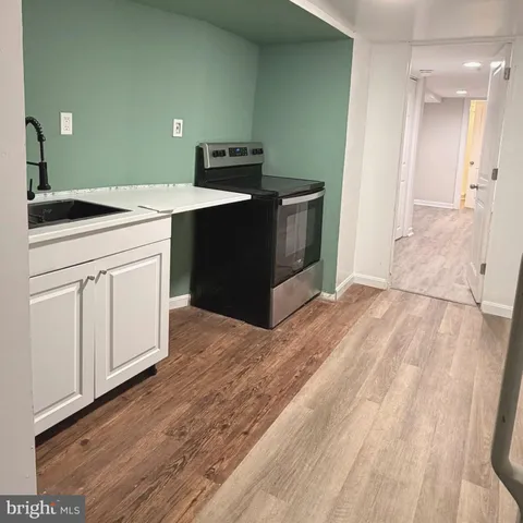 a kitchen with a sink and cabinets