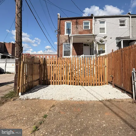 a front view of a house with a fence