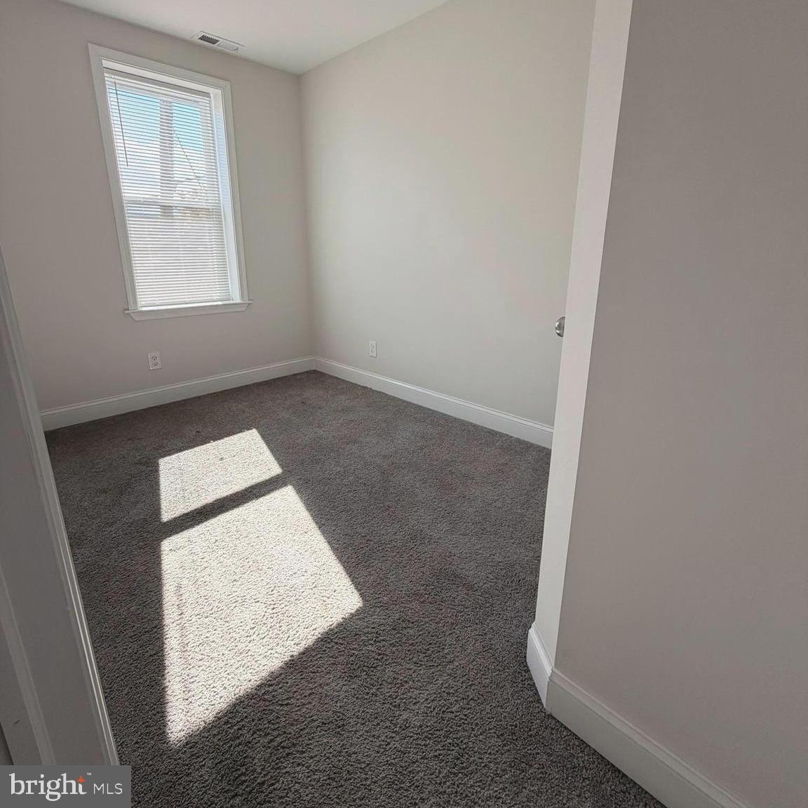 2631 West Cold Spring Lane Baltimore, MD 21215 - Photo 8 of 20 an empty room with windows