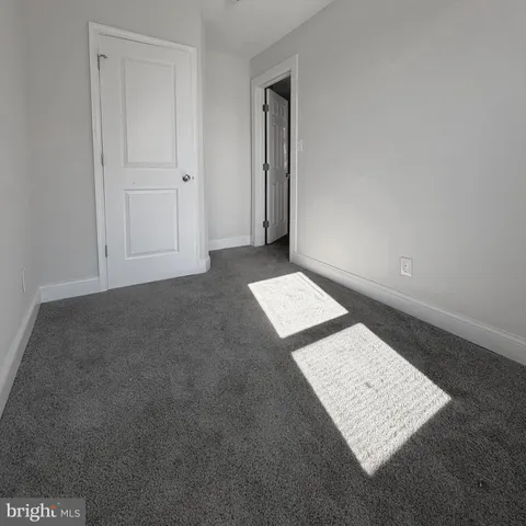 an empty room with a book shelf