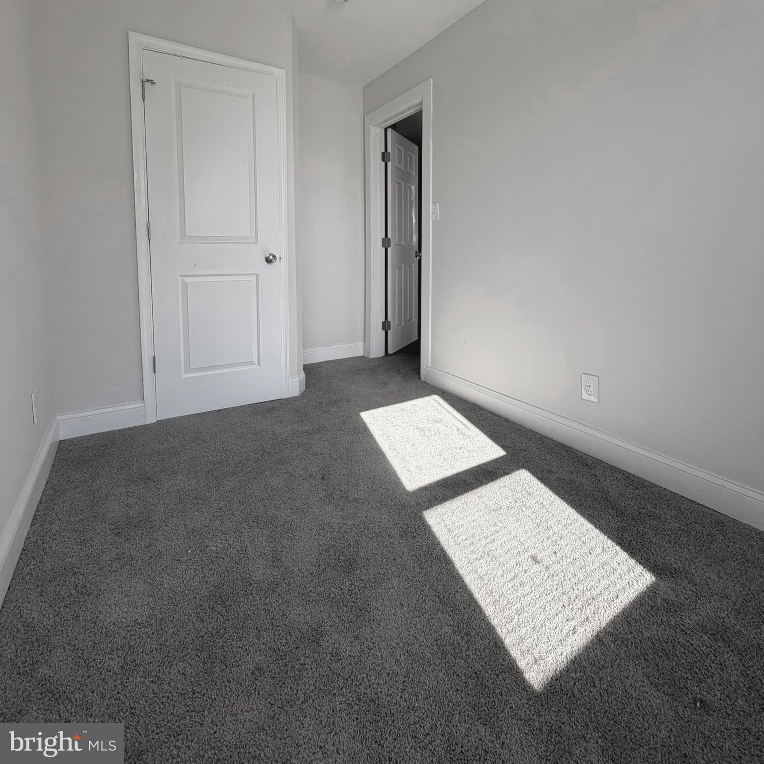 2631 West Cold Spring Lane Baltimore, MD 21215 - Photo 9 of 20 an empty room with a book shelf