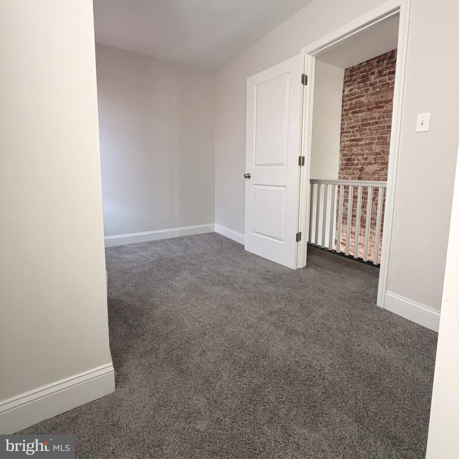 2631 West Cold Spring Lane Baltimore, MD 21215 - Photo 10 of 20 an empty room with windows