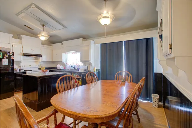a dining room with furniture and chandelier