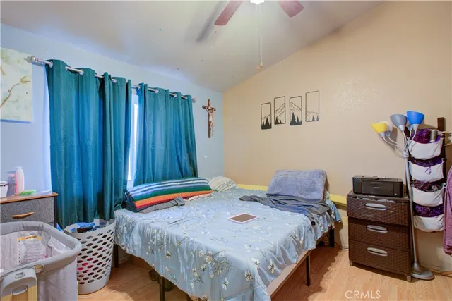 a bedroom with a bed and a chair