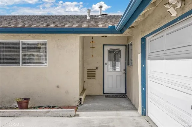 a view of a livingroom with wooden floor and a window