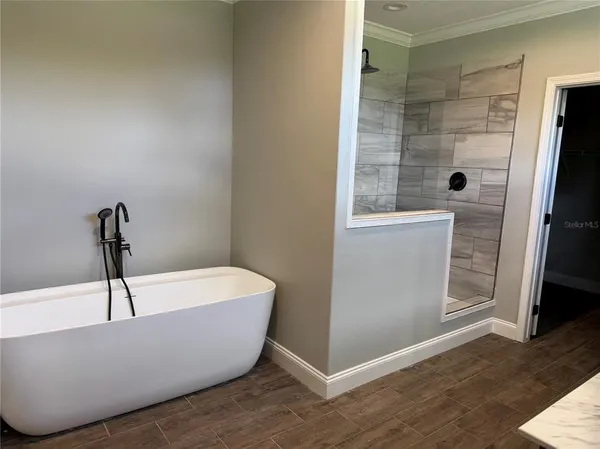 a white tub sitting in a bathroom