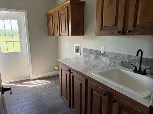 a kitchen with a sink and cabinets
