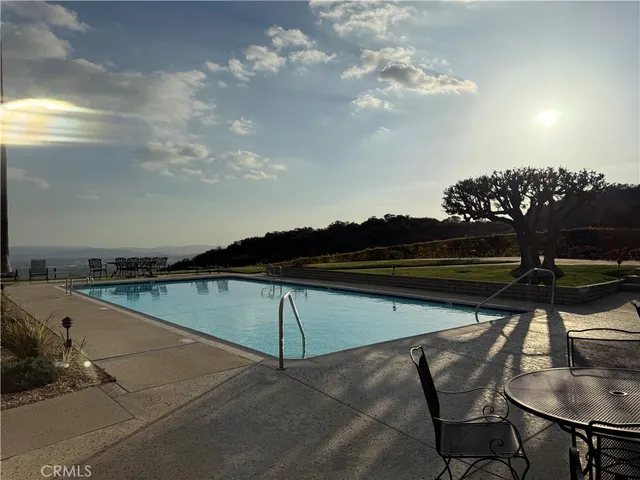 a view of chairs and table in the patio