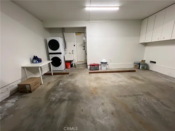 a view of a kitchen with a sink and a stove top oven
