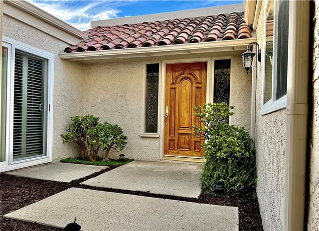 a front view of a house with garden