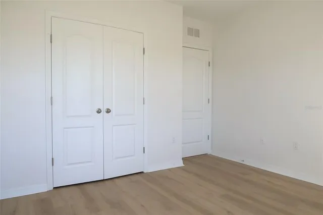 a bathroom with a granite countertop sink toilet and bathtub