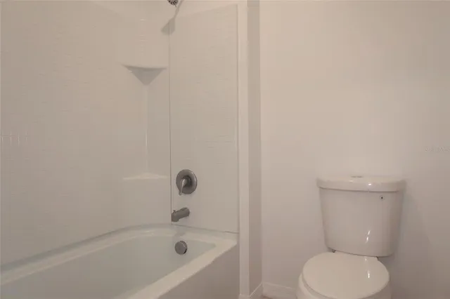 a bathroom with a shower curtain and a sink