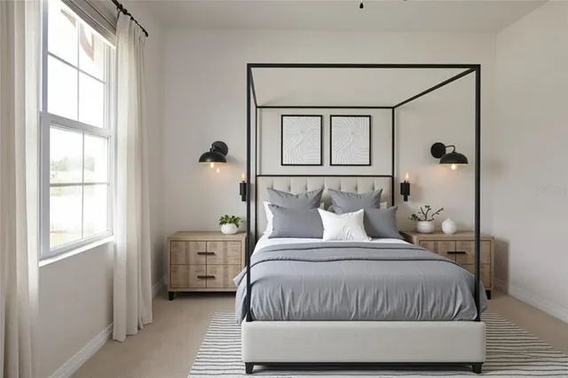 a spacious bedroom with a bed and a couch