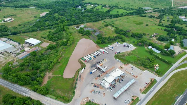 an aerial view of a house with a garden