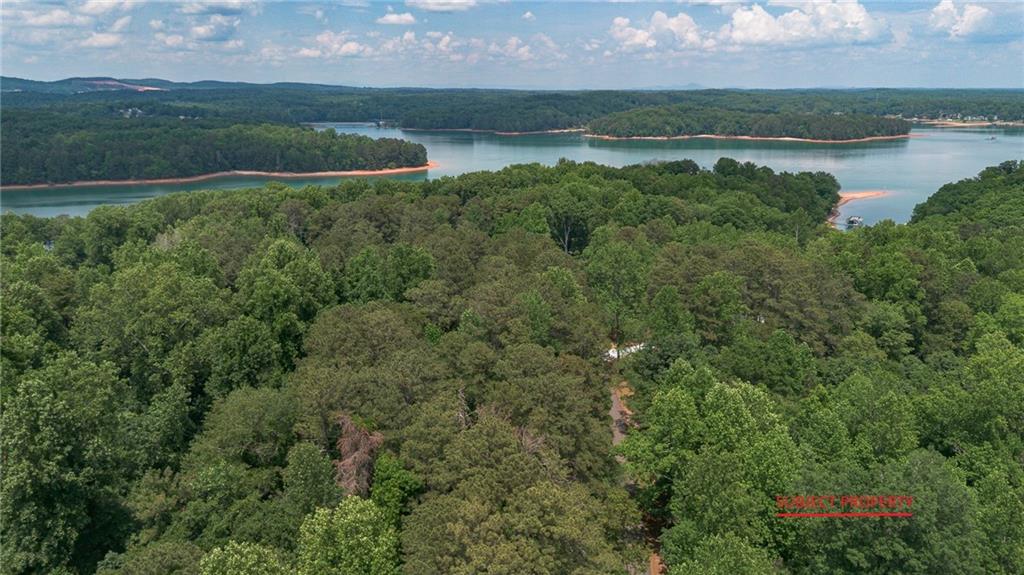 0 Indian Knoll Road Cumming, GA 30041 - Photo 1 of 17 a view of a lake from a yard