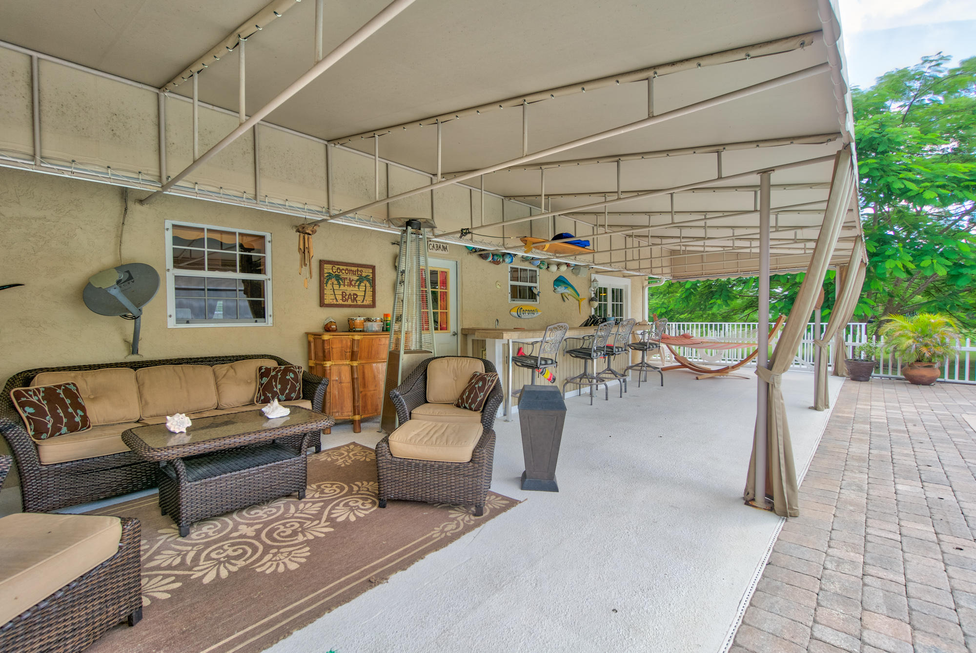 3240 Southeast Chandelle Road Jupiter, FL 33478 - Photo 14 of 30 Immense covered deck area abuts pool