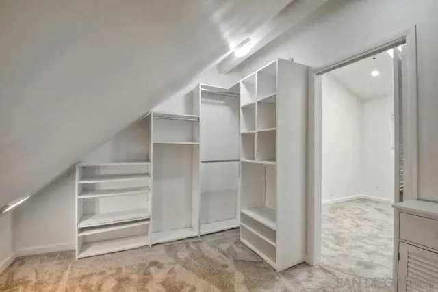 a view of an empty walk in closet