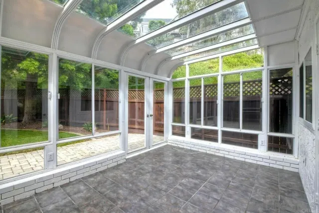 a view of an empty room with a large window