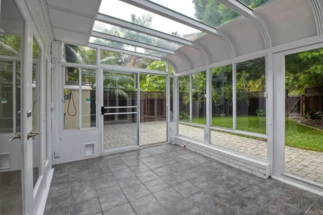 a view of an empty room with a balcony