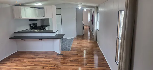 a view of a storage & utility room with a sink