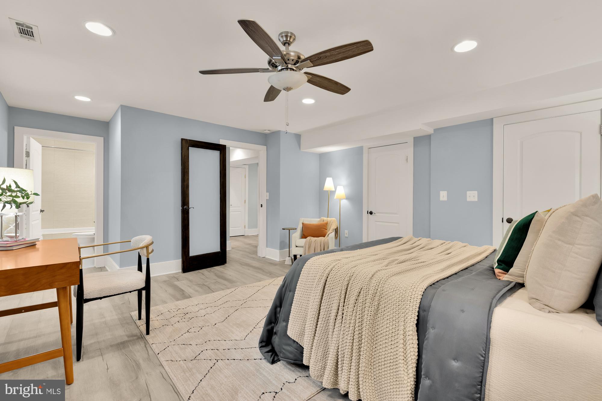 1409 G Street Northeast, Unit 5 Washington, DC 20002 - Photo 15 of 29 a bed room with a bed and a chair