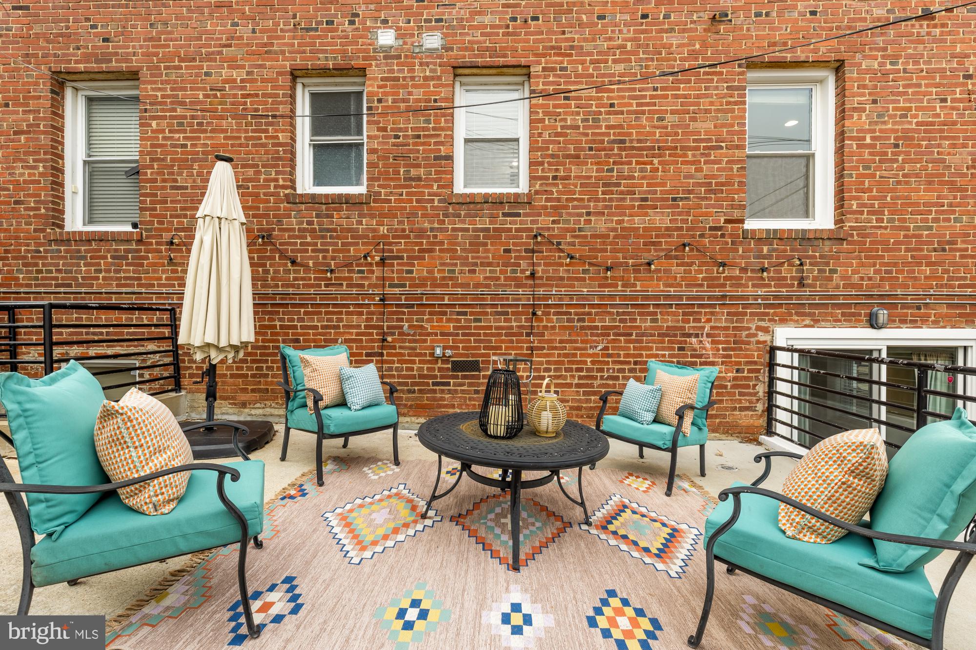 1409 G Street Northeast, Unit 5 Washington, DC 20002 - Photo 23 of 29 a view of a chairs with a table in the patio