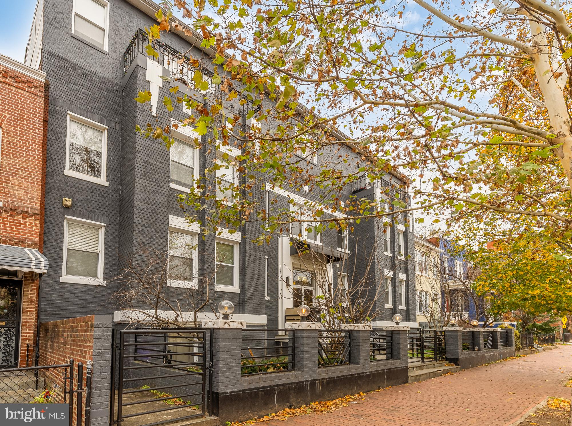 1409 G Street Northeast, Unit 5 Washington, DC 20002 - Photo 28 of 29 a city street lined with tall buildings