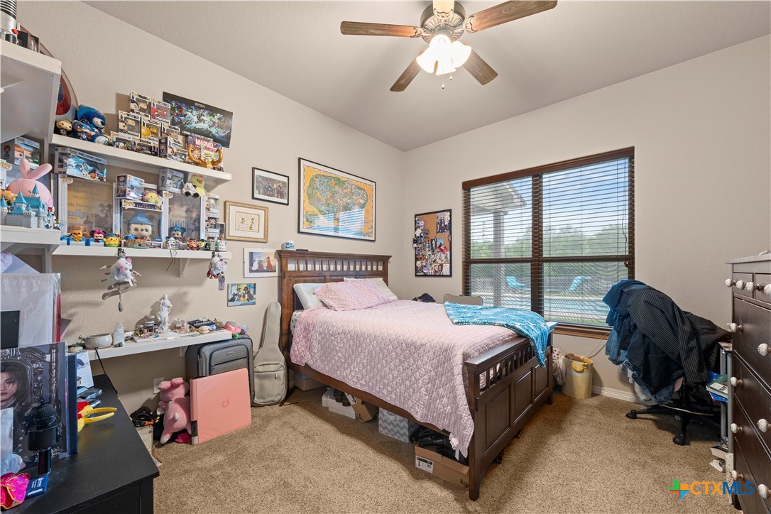 2649 Bowles Ranch Road Belton, TX 76513 - Photo 26 of 36 a bedroom with a bed furniture and a large window