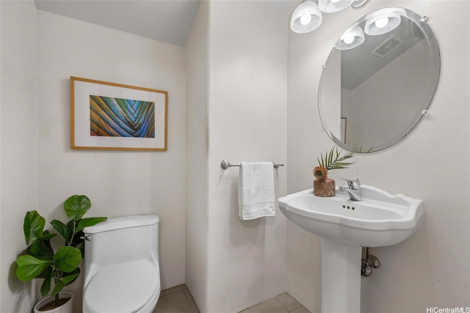 520 Lunalilo Home Road, Unit 313 Honolulu, HI 96825 - Photo 12 of 25 a bathroom with a sink and toilet