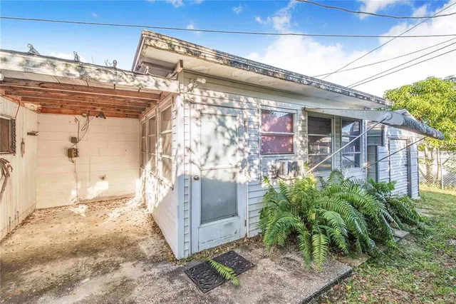 a view of yard with wooden fence