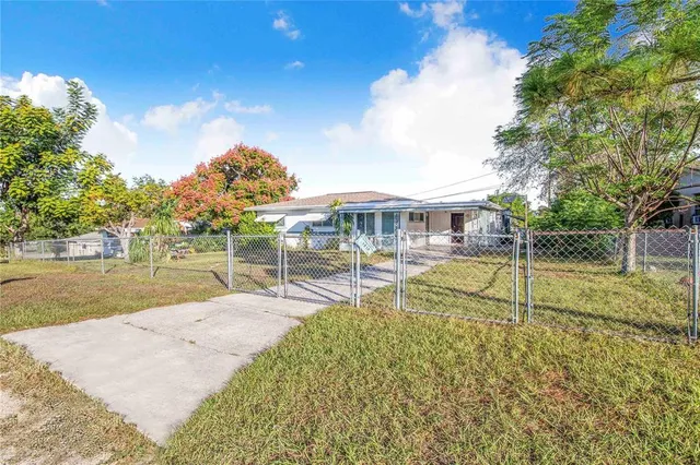 a house view with a backyard space