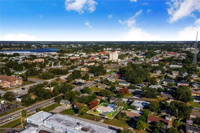 an aerial view of a house with a swimming pool