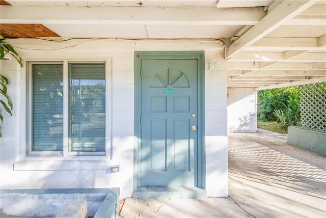 a front view of a house with a glass door