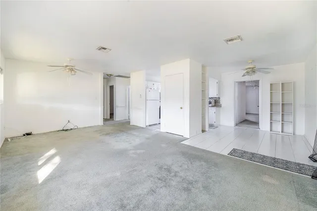 a view of a hallway with a chandelier