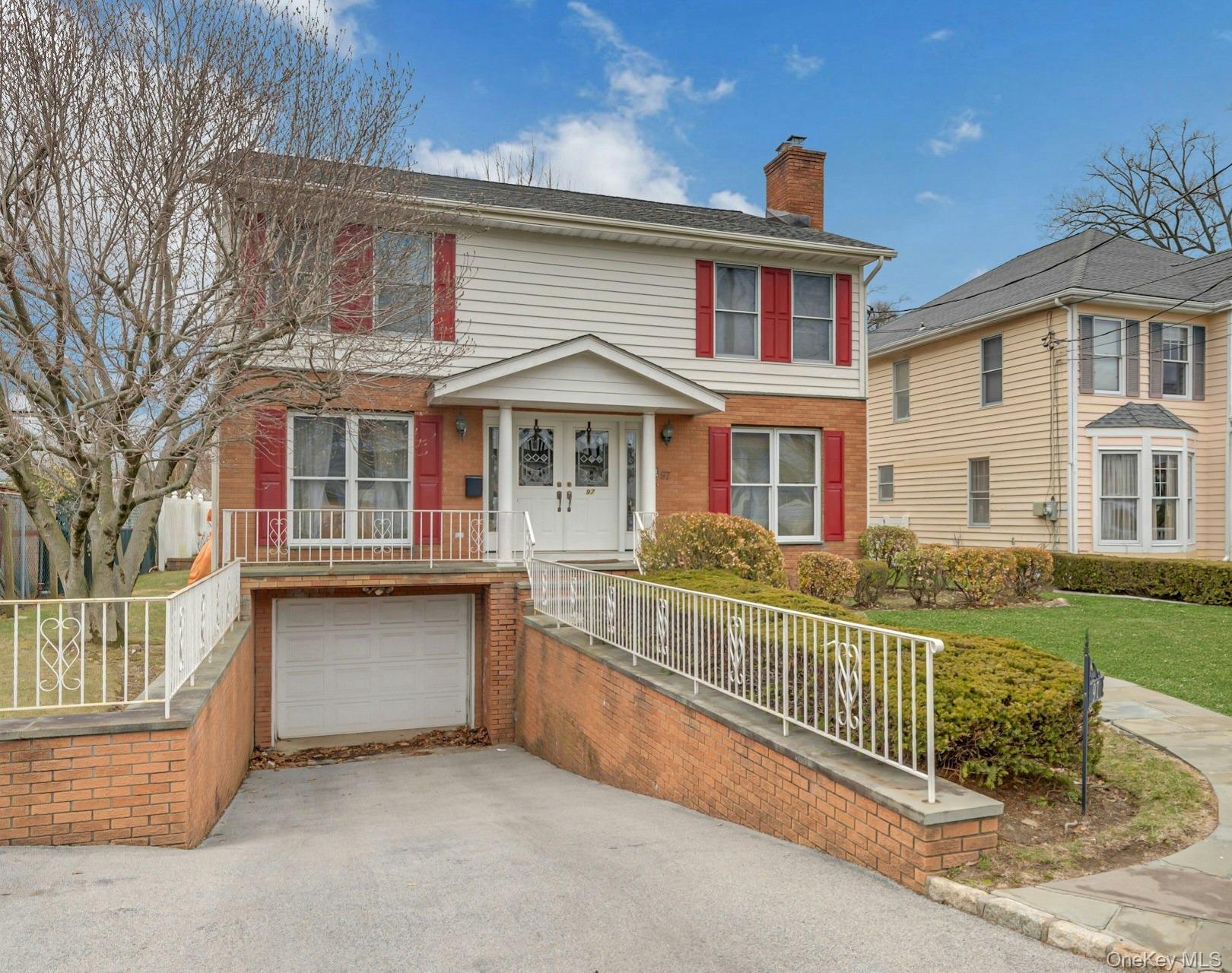 97 Bradley Road Scarsdale, NY 10583 - Photo 1 of 27 front view of a house with a yard
