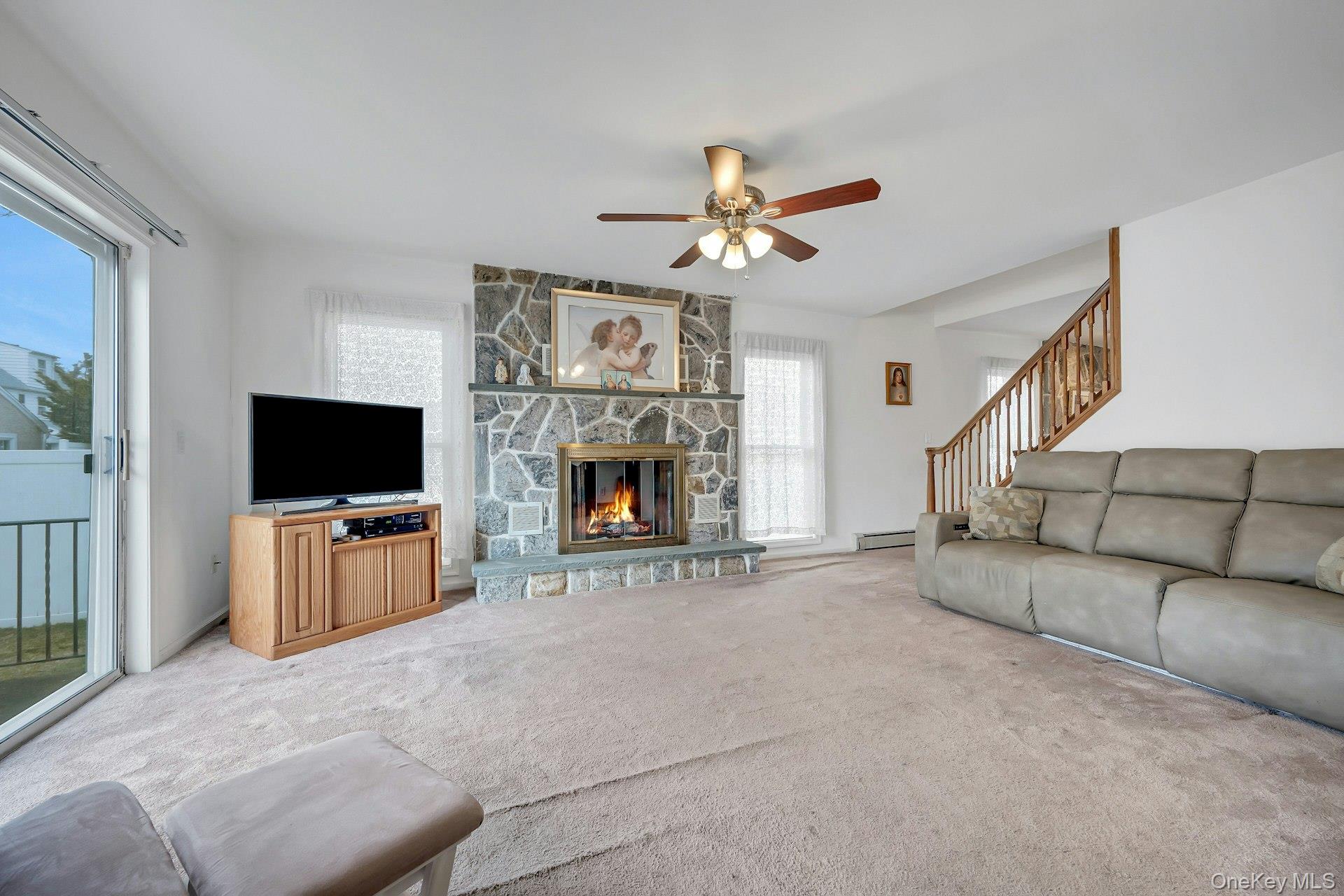 97 Bradley Road Scarsdale, NY 10583 - Photo 11 of 27 a living room with furniture and a flat screen tv